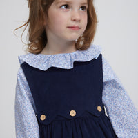 Little English traditional clothing, bespoke blouse with long sleeves in blue vinings pattern, ruffle around neck and sleeve cuffs with button panel jumper in navy corduroy