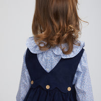 Little English traditional clothing, bespoke blouse with long sleeves in blue vinings pattern, ruffle around neck and sleeve cuffs with button panel jumper in navy, for little girl 