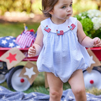 Little English traditional children's clothing. Girl's light blue and white stripe seersucker bubble with flag applique for summer.  4th of July outfit for baby girl