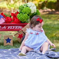 Little English traditional children's clothing. Girl's light blue and white stripe seersucker bubble with flag applique for summer.  4th of July outfit for baby girl