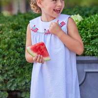 Little English traditional children's clothing.  Girl's light blue and white stripe seersucker dress with flag applique for summer.  Girl's 4th of July outfit