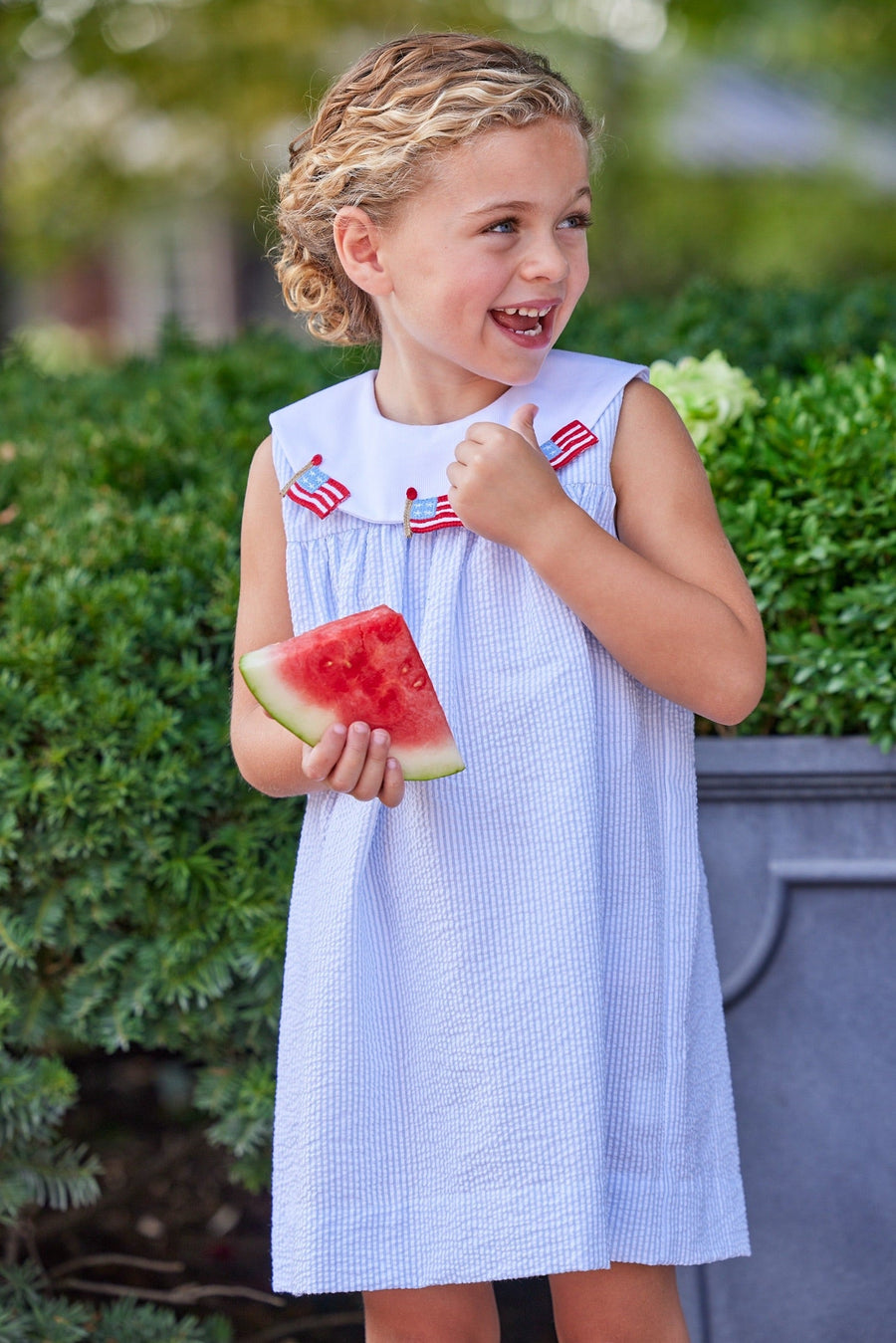 Little English traditional children's clothing.  Girl's light blue and white stripe seersucker dress with flag applique for summer.  Girl's 4th of July outfit