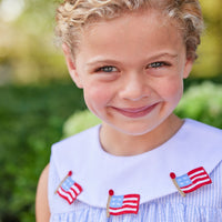 Little English traditional children's clothing.  Girl's light blue and white stripe seersucker dress with flag applique for summer.  Girl's 4th of July outfit