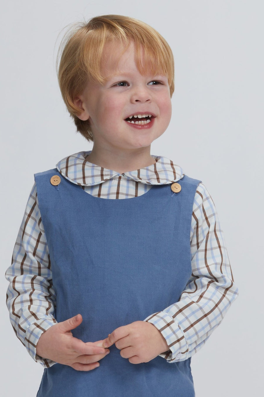 Little English traditional clothing, button tab john john in stormy blue corduroy with Peter Pan shirt in brown and light blue plaid, for little boy