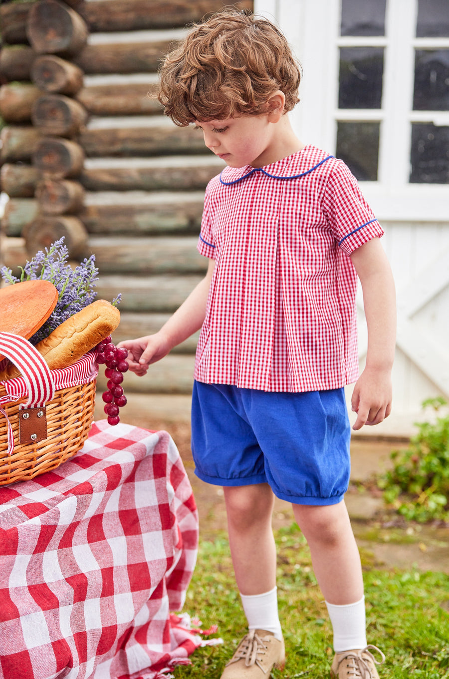 Little English traditional children's clothing.  Red and white gingham peter pan shirt and coordinating royal blue corduroy shorts.  Back to school outfit for little boys for Fall.