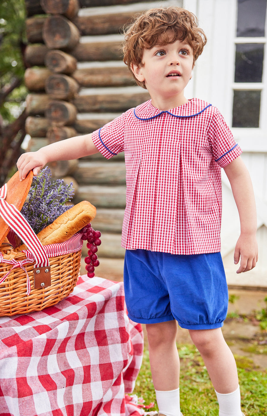 Little English traditional children's clothing.  Red and white gingham peter pan shirt and coordinating royal blue corduroy shorts.  Back to school outfit for little boys for Fall.