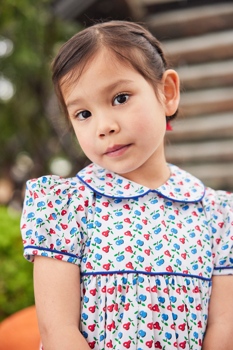 Little English traditional children's clothing. Sweet blue and red pear print peter pan dress for little girl. Adorable back to school outfit for Fall.