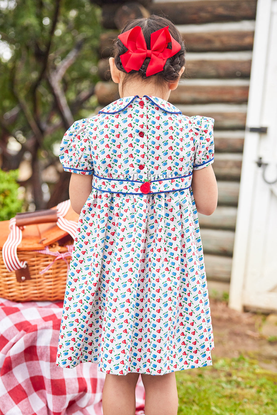 Little English traditional children's clothing. Sweet blue and red pear print peter pan dress for little girl. Adorable back to school outfit for Fall.