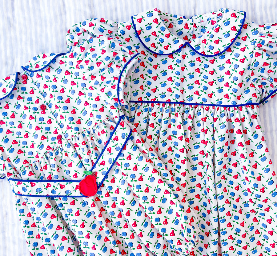 Little English traditional children's clothing. Sweet blue and red pear print peter pan bubble for baby girl. Adorable back to school outfit for Fall.