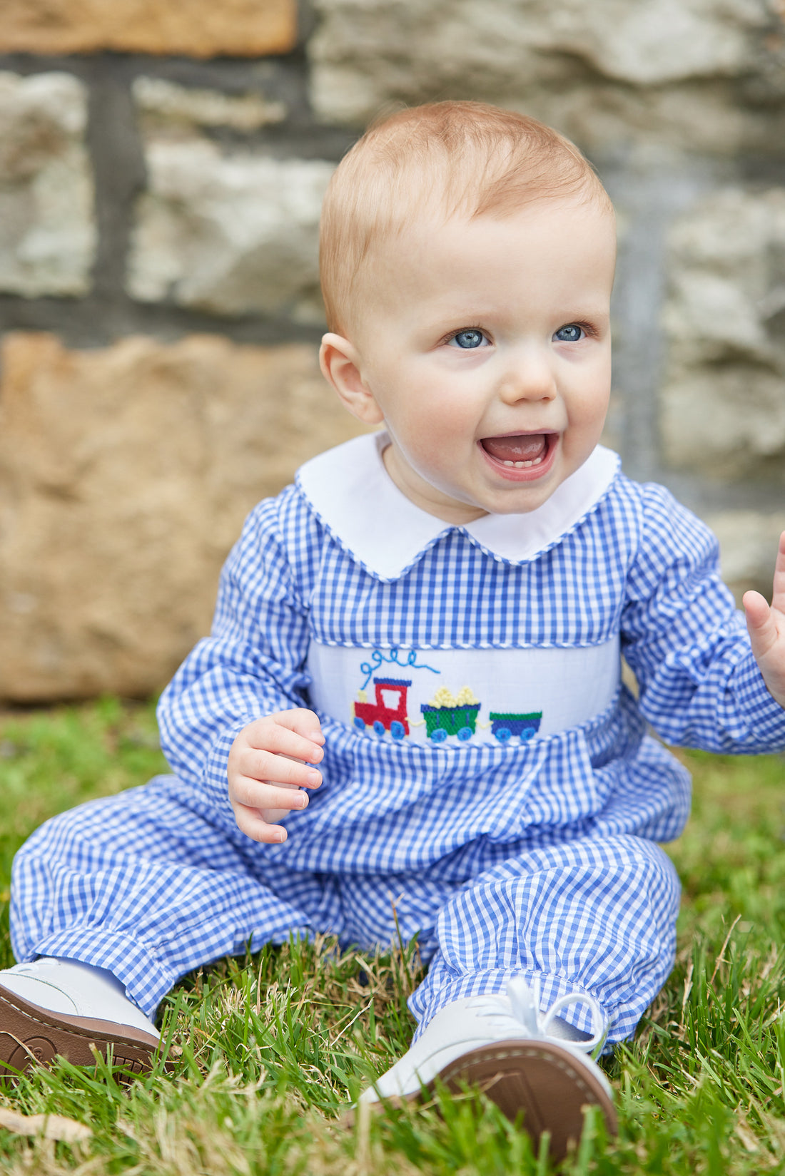 Little English traditional clothing, chest smocked romper in blue gingham pattern with embroidered train on chest for baby boy