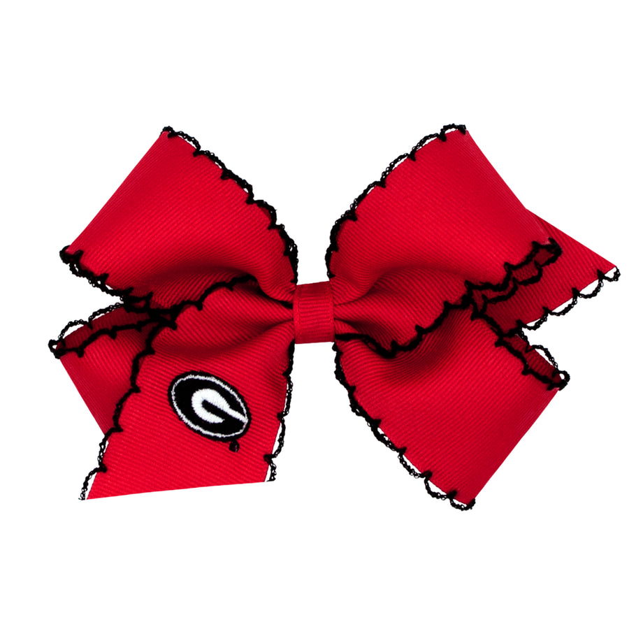 Little English traditional children's clothing.  Red grosgrain hair bow trimmed in black with black and white Georgia logo embroidery.  Game day hair bow for girls for Fall