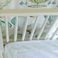 Little English classic nursery goods for baby, white crib sheet with simple light green embroidery along the edges for baby