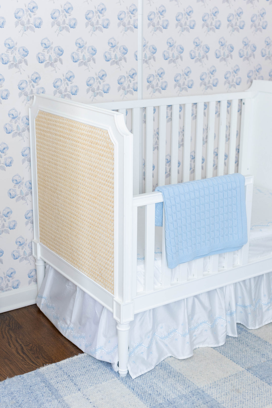 Little English classic nursery goods for baby, white crib sheet with simple light blue embroidery along the edges for baby