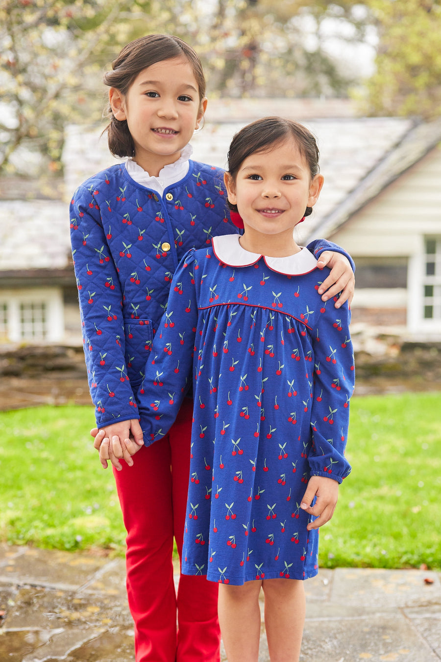 Little English traditional children's clothing.  Blue quilted jacket with cherry print for girls for Fall