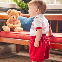 Little English traditional children's clothing, Graham Short Set with red bottoms and collared white top, smocked detailing on chest and buttons around hips, for little boy