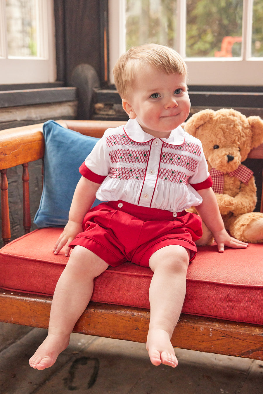 Little English traditional children's clothing, Graham Short Set with red bottoms and collared white top, smocked detailing on chest and buttons around hips, for little boy