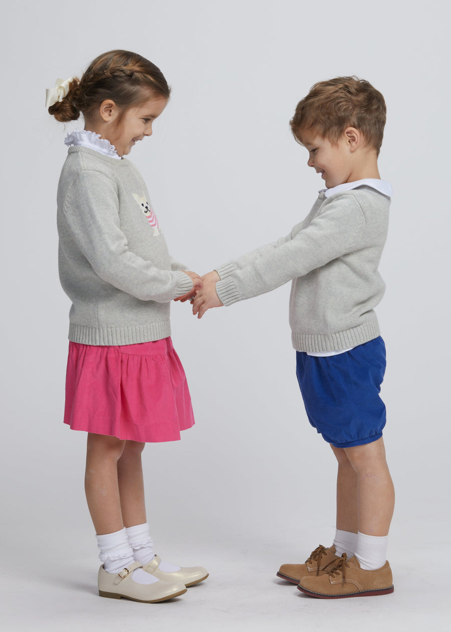 Little English traditional children's clothing. Gray intarsia sweater with frenchie dog motif for little girl, Gray intarsia sweater with frenchie dog motif for little boy, Jillian skirt in hot pink corduroy, banded short in royal blue corduroy, long sleeve hastings polo in  white, piped peter pan shirt in white, for fall