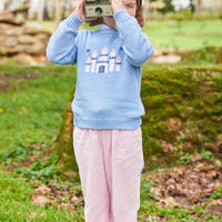 Little English traditional children's clothing. Light blue intarsia sweater with castle motif for little girl for Fall.