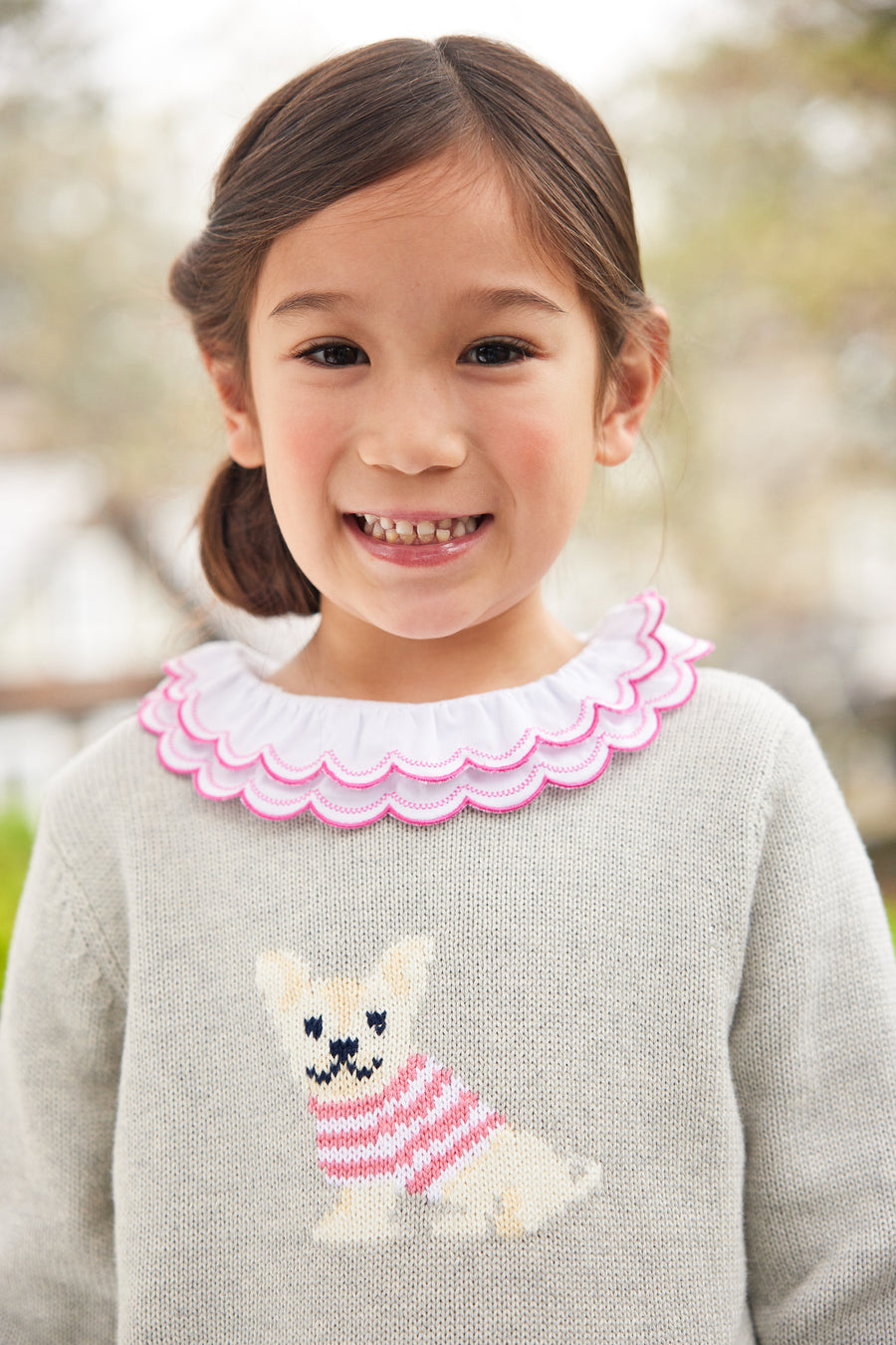 Little English traditional children's clothing. Gray intarsia sweater with frenchie dog motif for little girl for Fall.