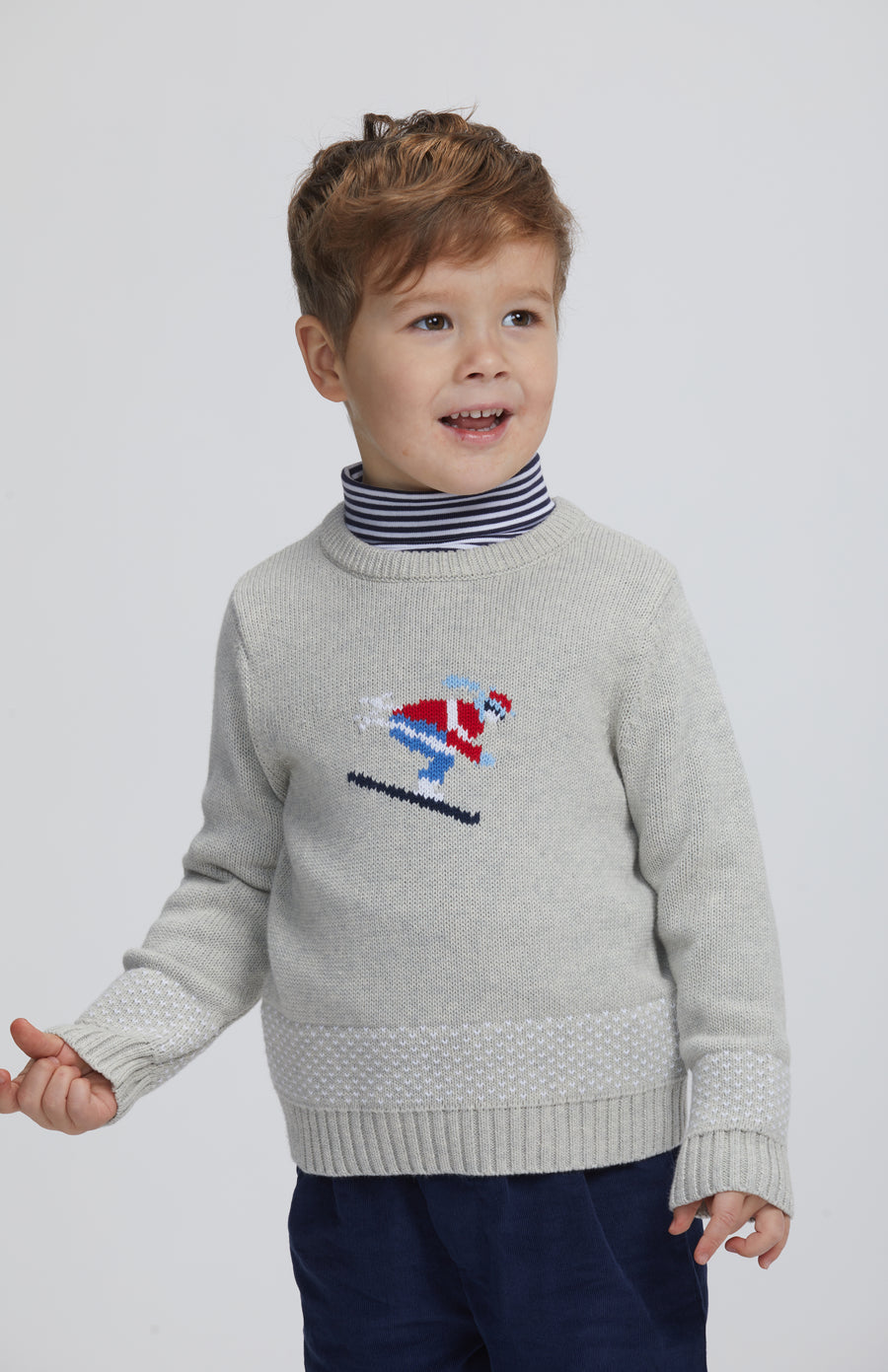 Little English traditional children's clothing.  Intarsia sweater with Ski motif on chest, striped turtleneck in navy, banded Pant in Navy, for little boy 