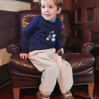 Little English traditional children's clothing. Navy blue intarsia sweater with tractor  motif for little boy for Fall.