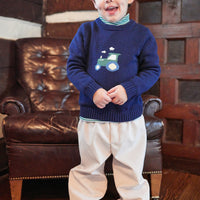 Little English traditional children's clothing. Navy blue intarsia sweater with tractor  motif for little boy for Fall.