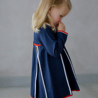 Little English traditional children's clothing. Navy long-sleeve peter pan dress with red and white trim for little girls for Fall