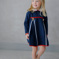 Little English traditional children's clothing. Navy long-sleeve peter pan dress with red and white trim for little girls for Fall