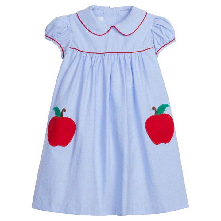 Little English traditional children's clothing. Light blue chambray dress for toddler girl . Back to school dress with red apple applique and red piping for fall.