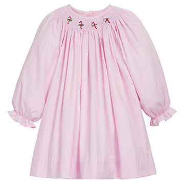 Little English traditional children's clothing. Light pink dress with candy canes for little girls. Fun holiday dress