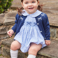 Little English traditional clothing, knit essential cardigan in navy with white bow embroidery around neckline and white buttons down the center, for little girl